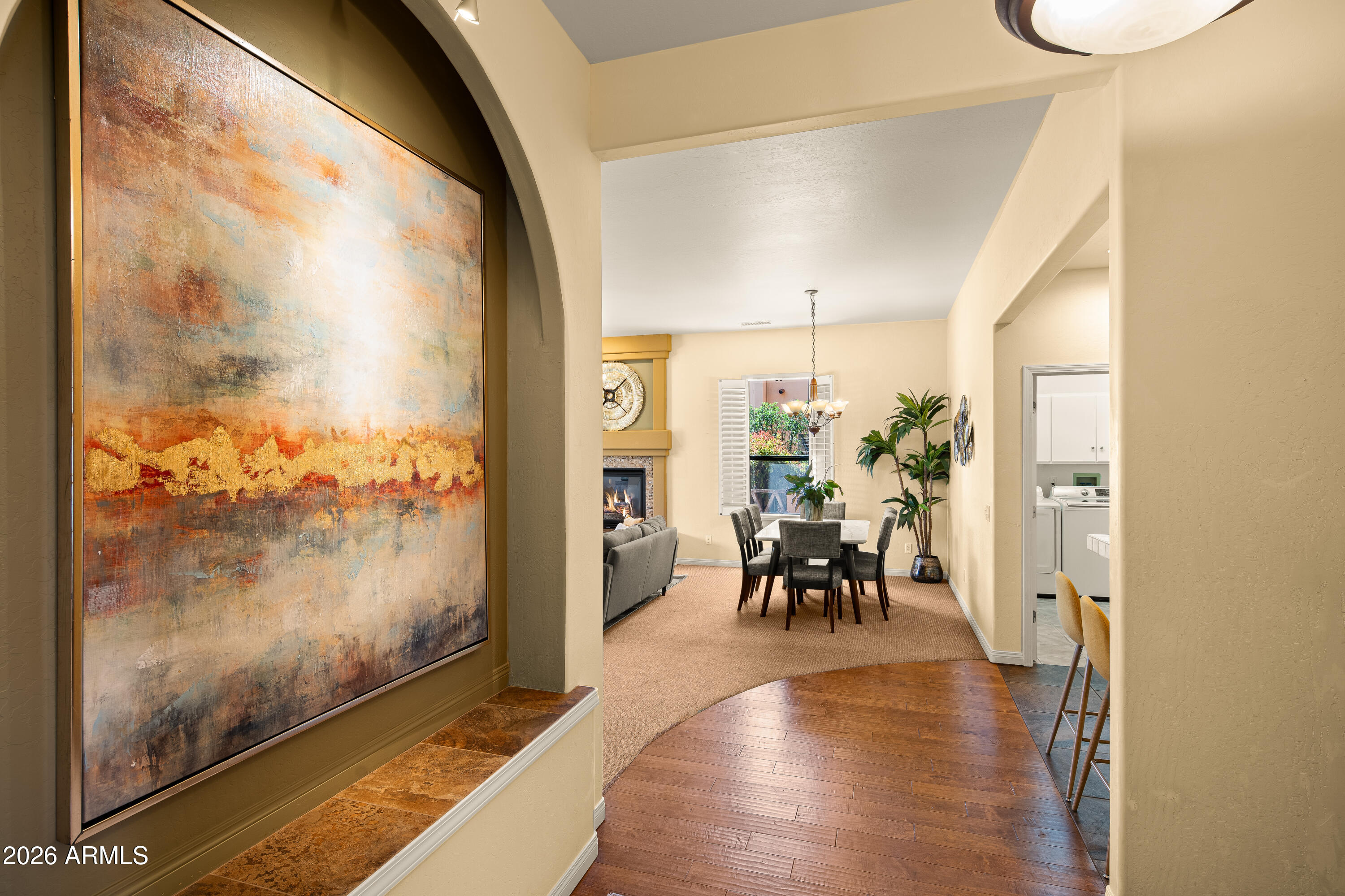 39 Rim Trail Circle Sedona, AZ 86351 - Photo 6 of 41 a dining room with furniture a floor to ceiling window and wooden floor