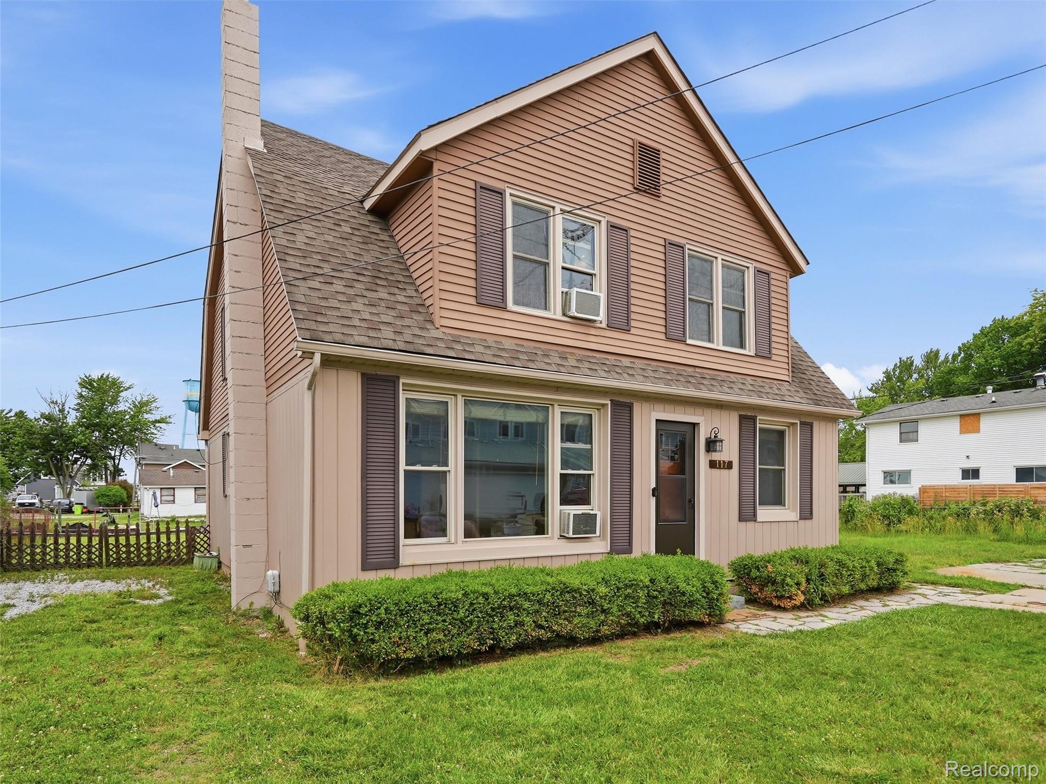 117 Kenyon Road Algonac, MI 48001 - Photo 2 of 47 Two-story residence featuring light brown siding and darker brown shingle accents
