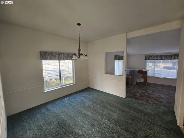 a kitchen with sink cabinets and stove top oven