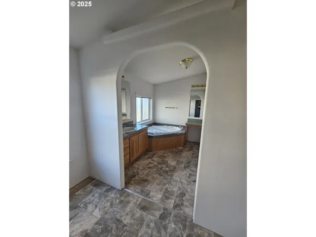 a bathroom with a sink a mirror and a toilet