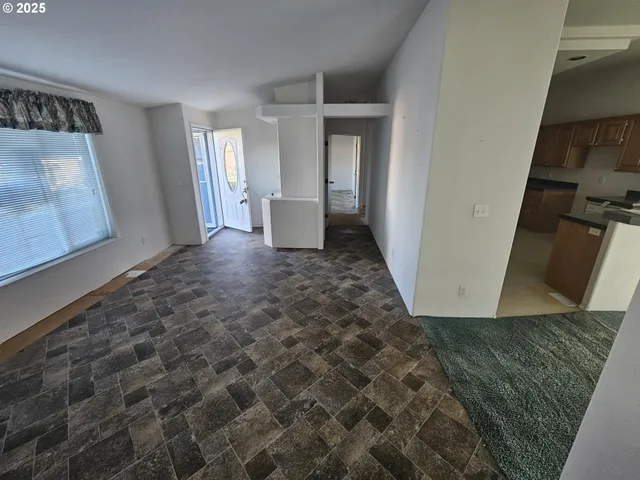 a view of a hallway with front door