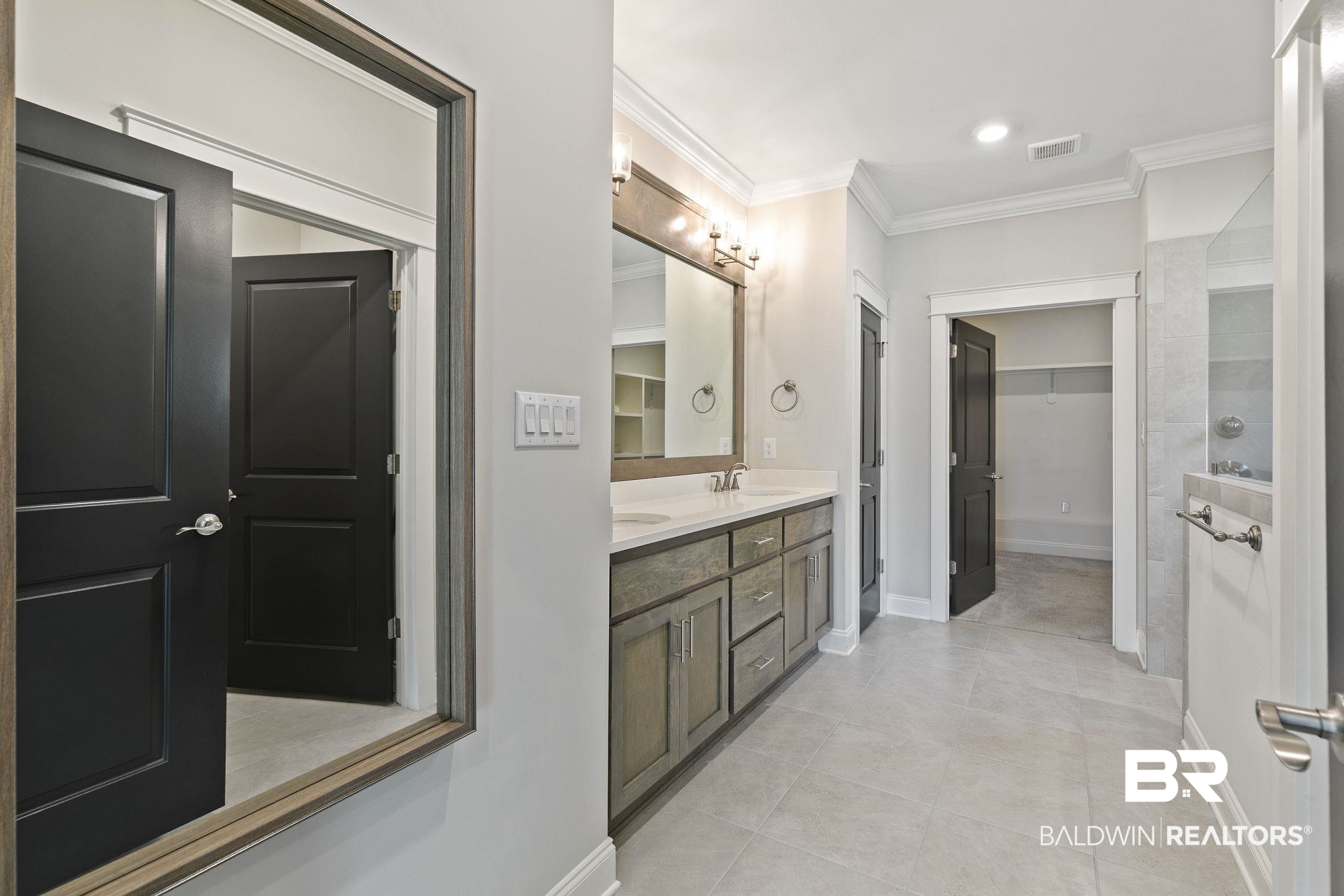 31654 Canopy Loop Daphne, AL 36527 - Photo 32 of 64 Bathroom featuring ornamental molding, a walk in closet, double vanity, and light tile patterned floors