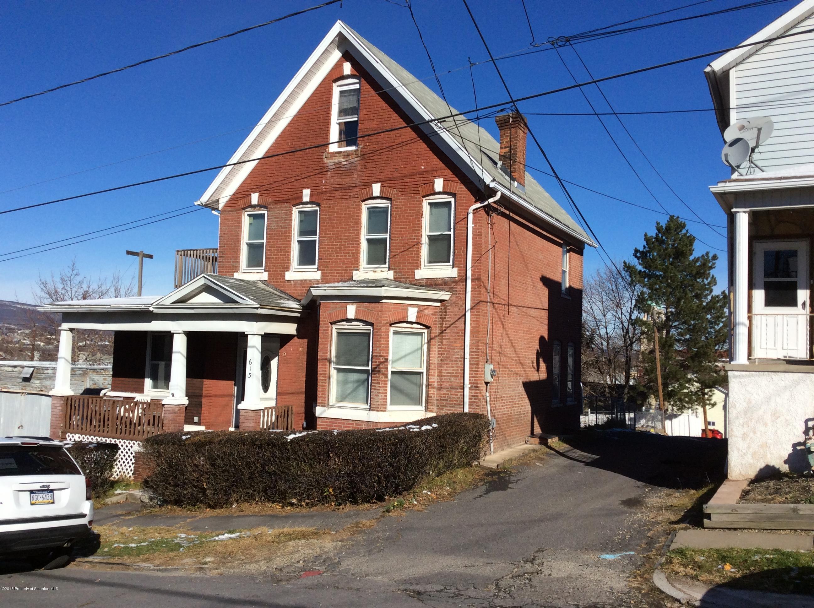 613 Fig Street Scranton, PA 18505 - Photo 1 of 36 a front view of a house with a yard
