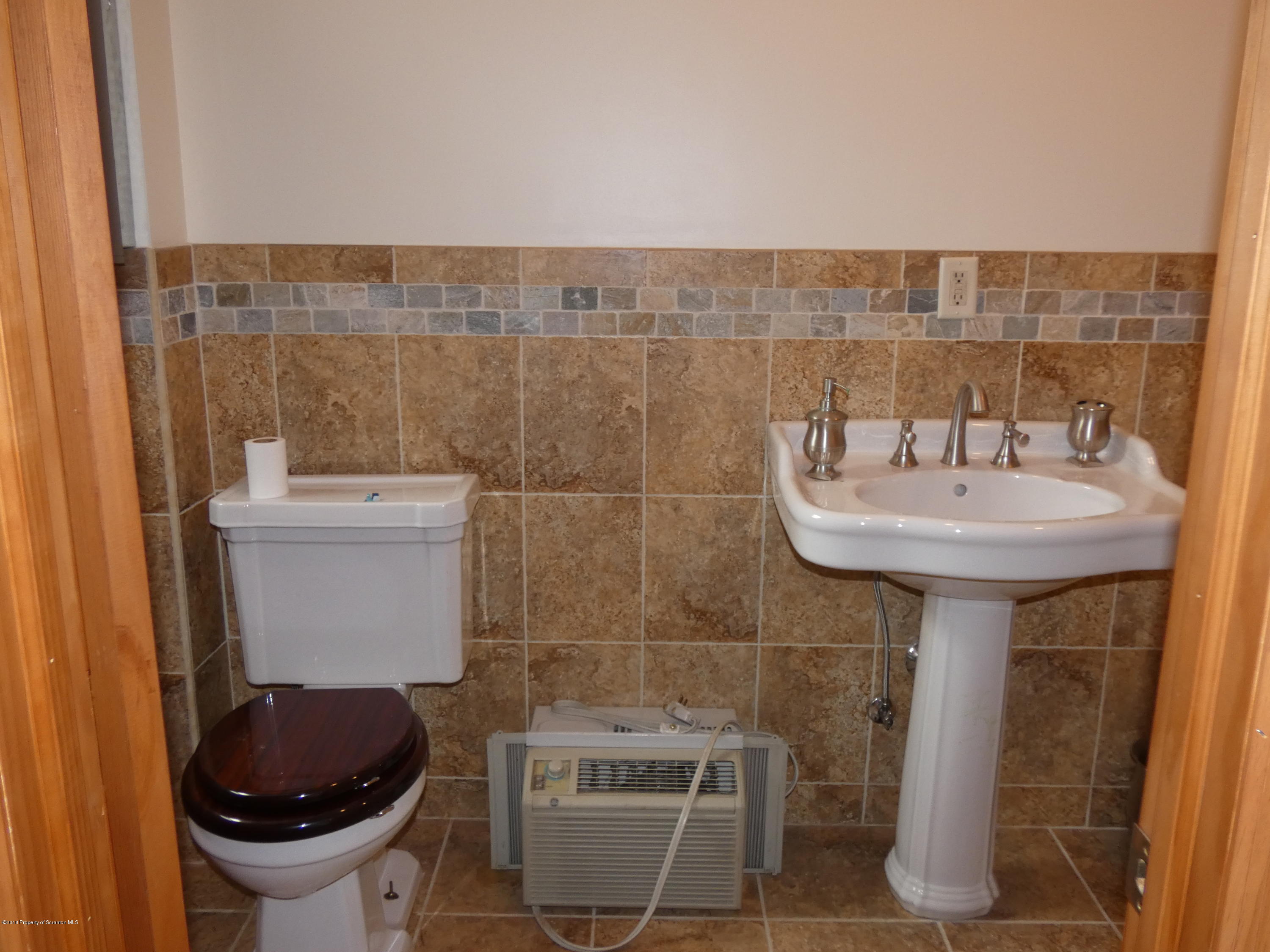 613 Fig Street Scranton, PA 18505 - Photo 13 of 36 a bathroom with a sink and toilet
