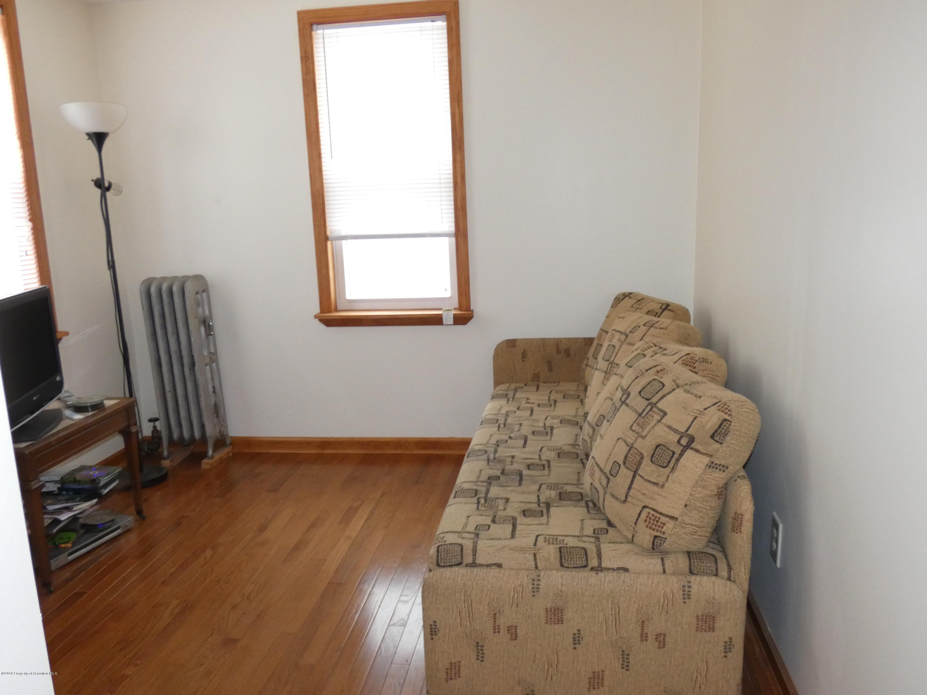 613 Fig Street Scranton, PA 18505 - Photo 18 of 36 a view of a workspace with wooden floor and a window