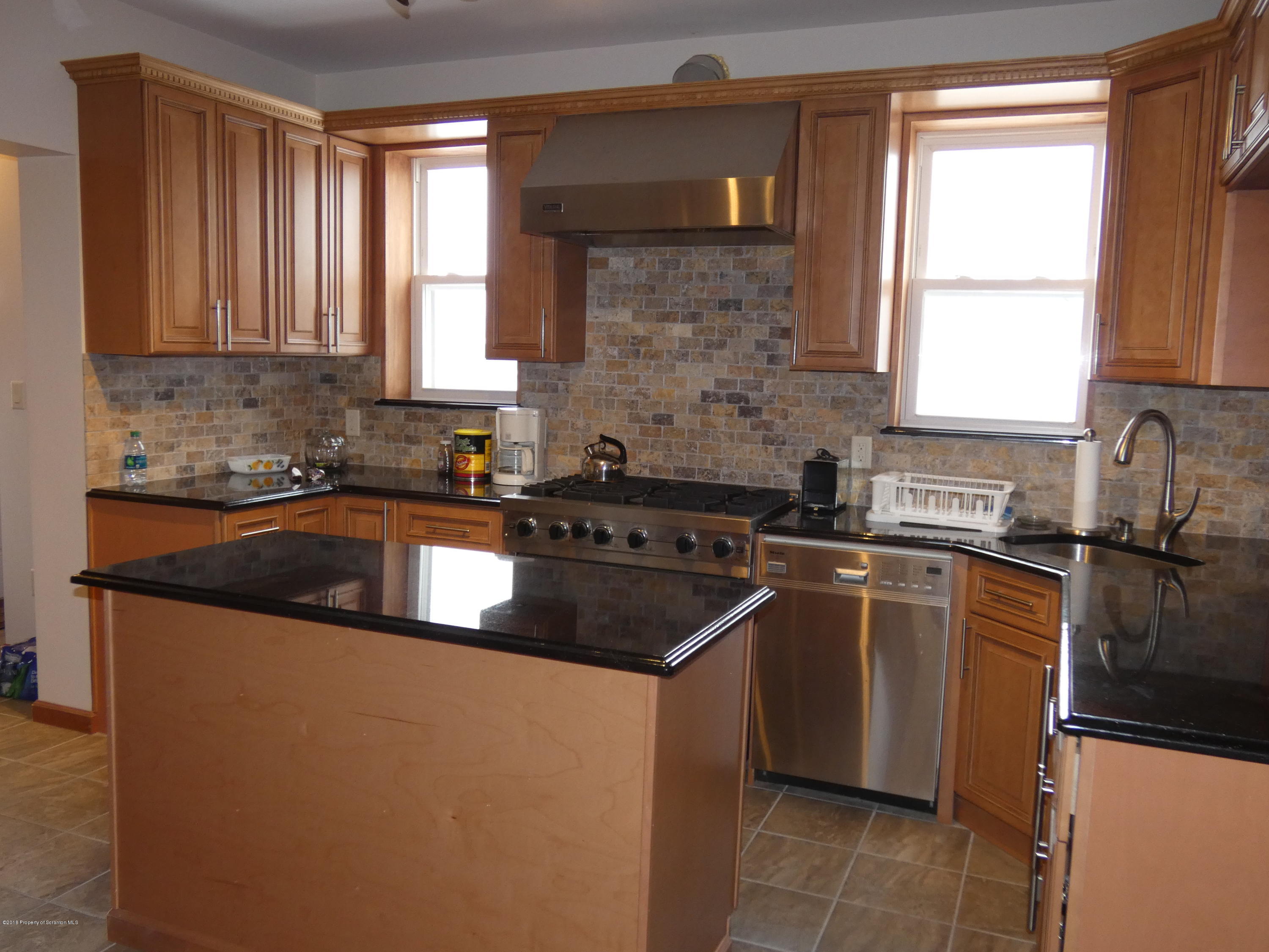 613 Fig Street Scranton, PA 18505 - Photo 2 of 36 a kitchen that has a sink and a stove