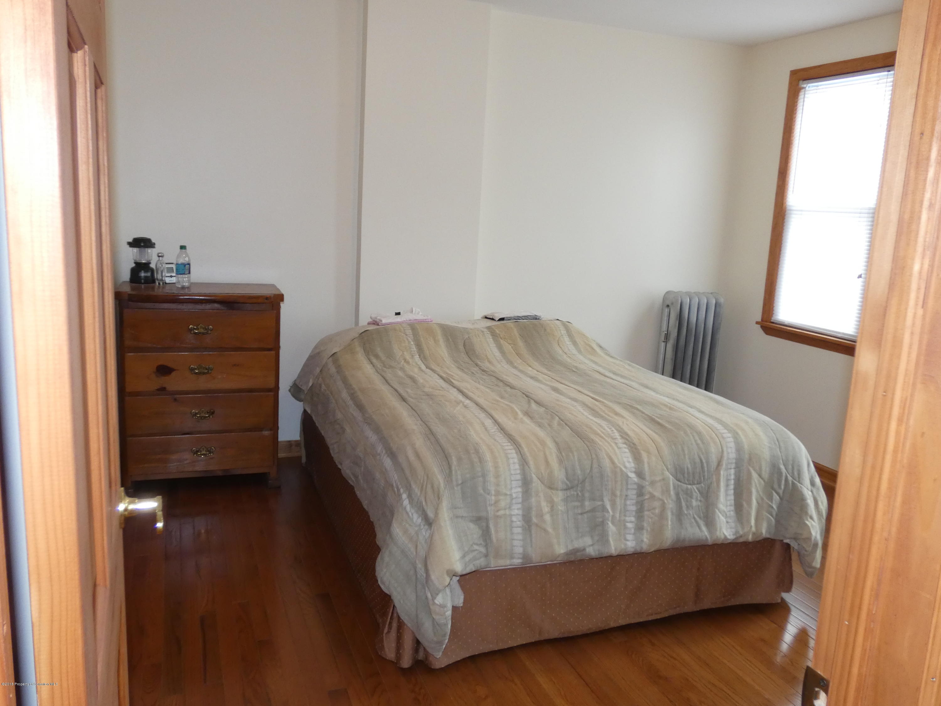 613 Fig Street Scranton, PA 18505 - Photo 21 of 36 a bedroom with a bed and a closet