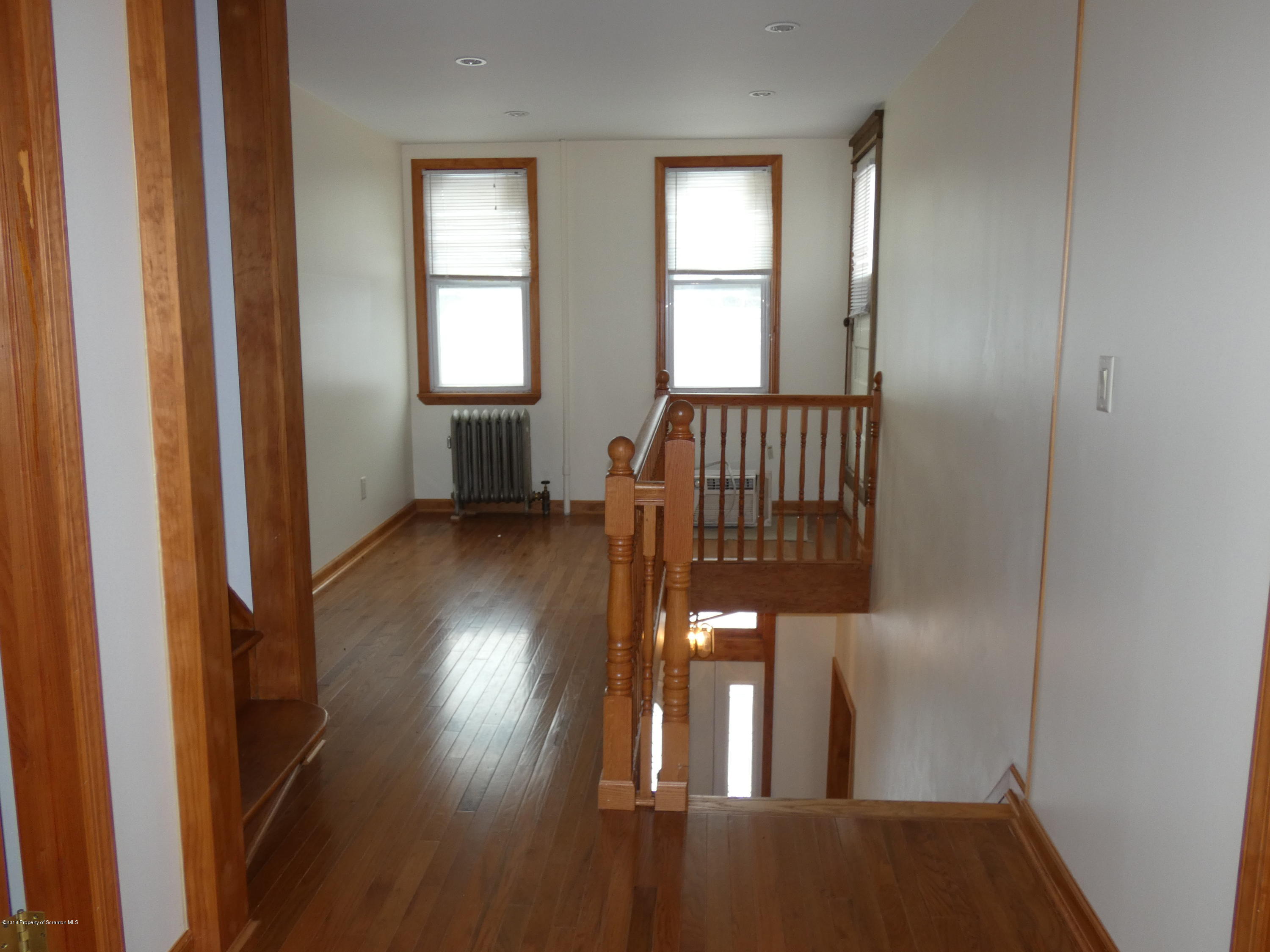 613 Fig Street Scranton, PA 18505 - Photo 27 of 36 a view of entryway with wooden floor