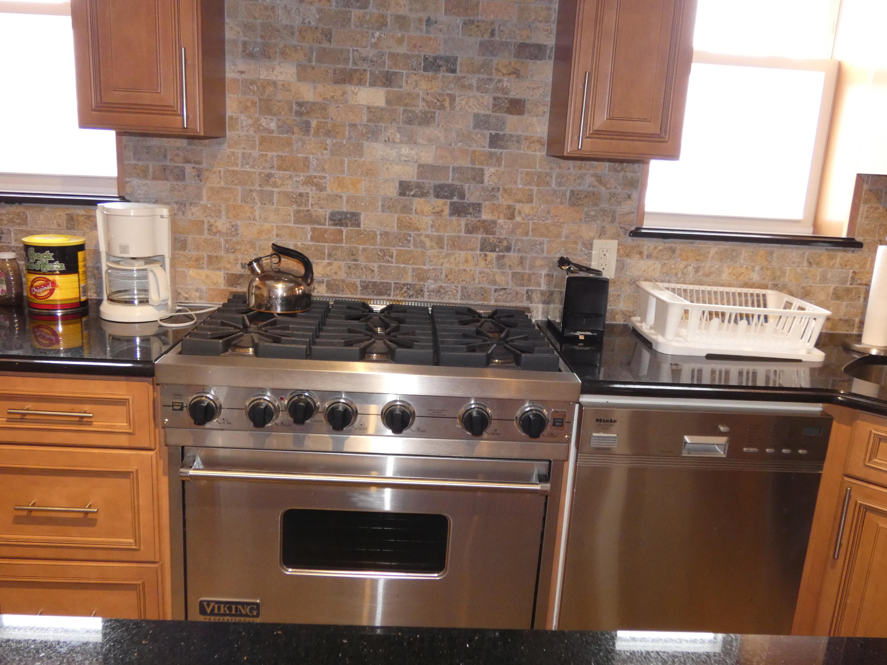 613 Fig Street Scranton, PA 18505 - Photo 3 of 36 a stove top oven sitting inside of a kitchen