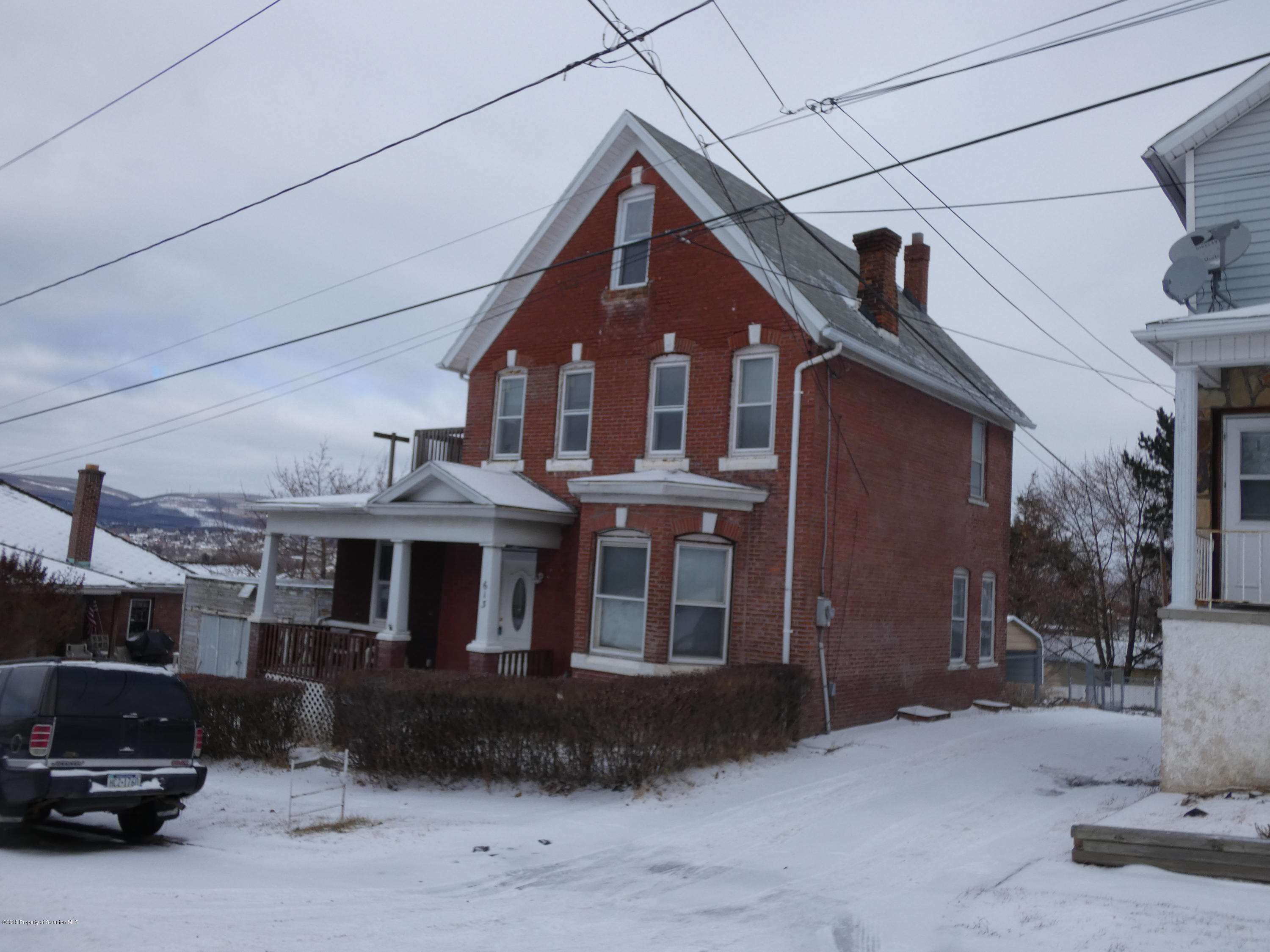 613 Fig Street Scranton, PA 18505 - Photo 31 of 36 a front view of a house with a yard