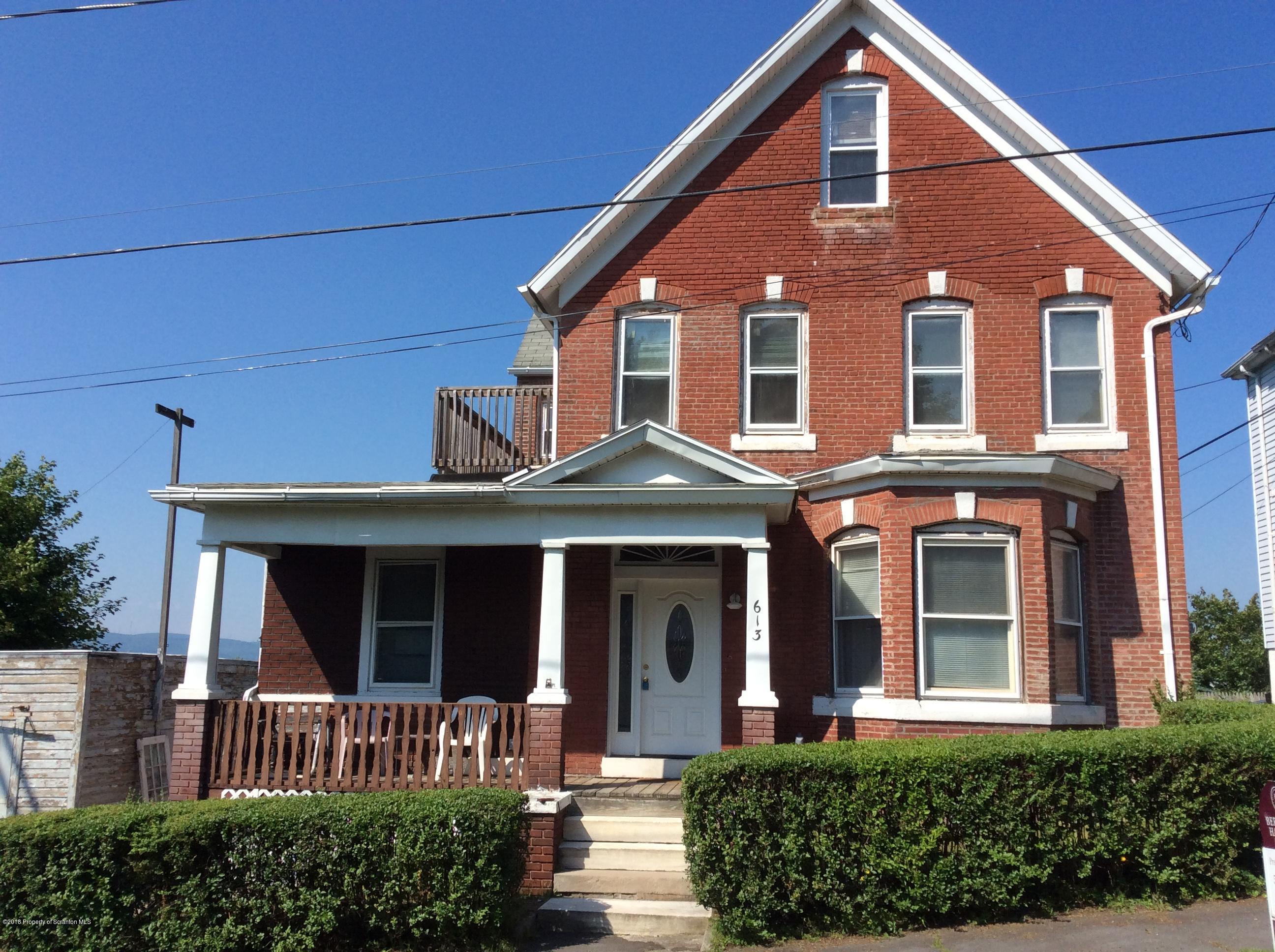 613 Fig Street Scranton, PA 18505 - Photo 33 of 36 front view of a brick house with a large window