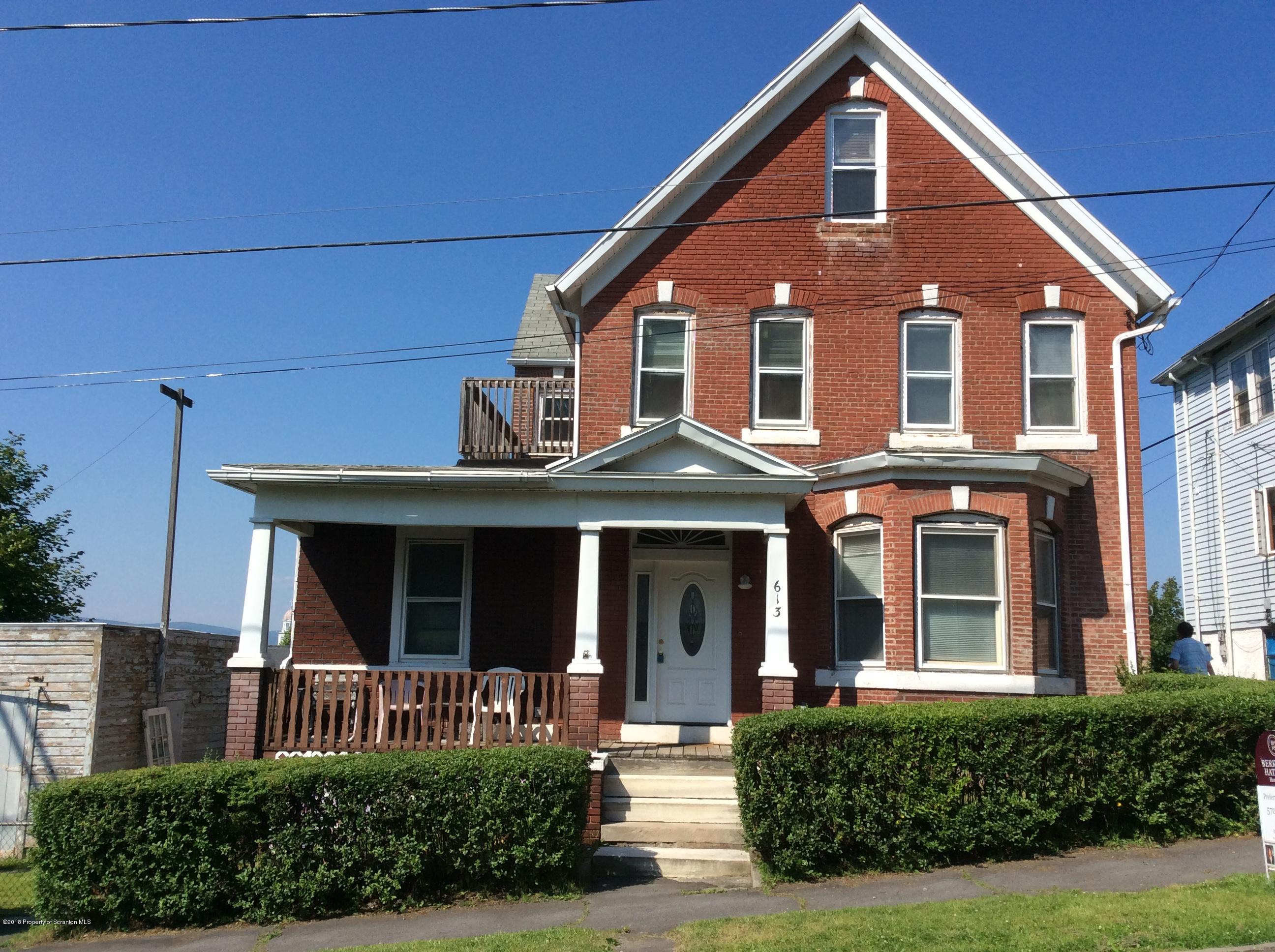 613 Fig Street Scranton, PA 18505 - Photo 34 of 36 a front view of a house with garden