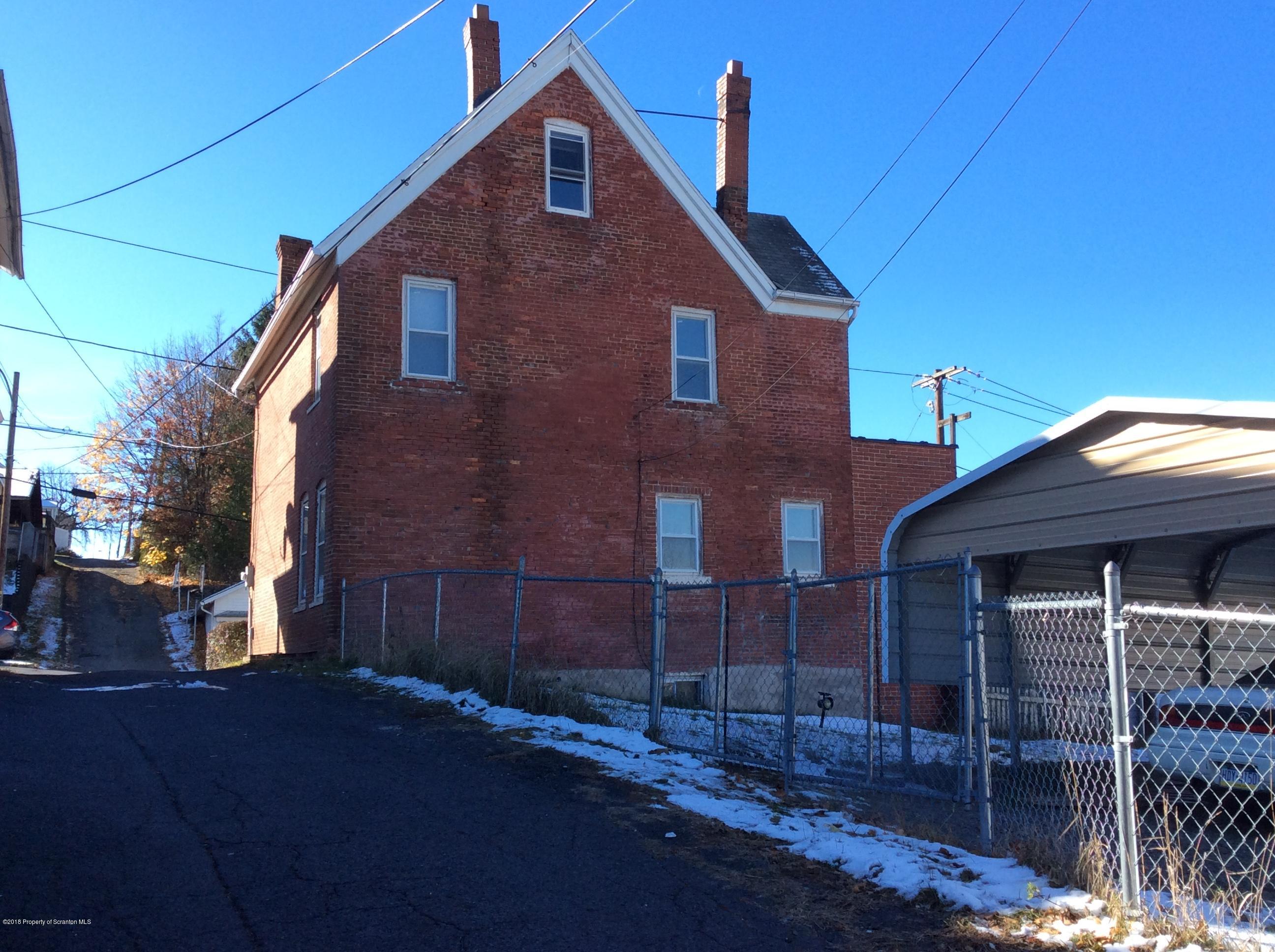 613 Fig Street Scranton, PA 18505 - Photo 35 of 36 a front view of a house with a yard