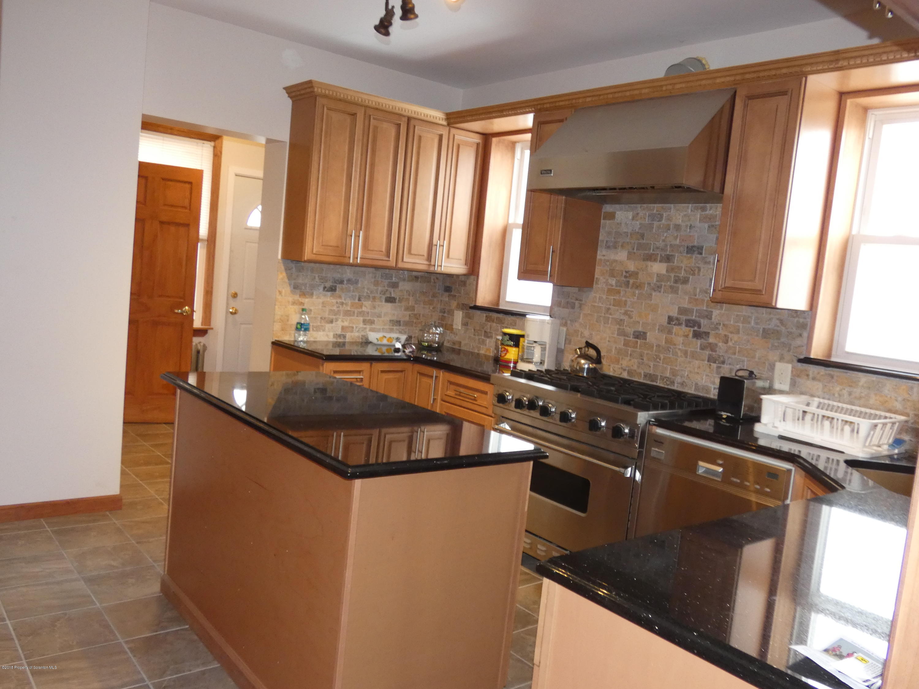 613 Fig Street Scranton, PA 18505 - Photo 5 of 36 a kitchen that has a sink and a stove