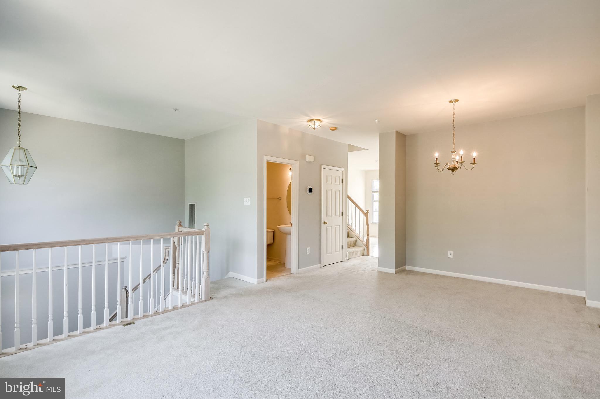 2702 Snowmill Court Ellicott City, MD 21043 - Photo 11 of 34 an empty room with a mirror