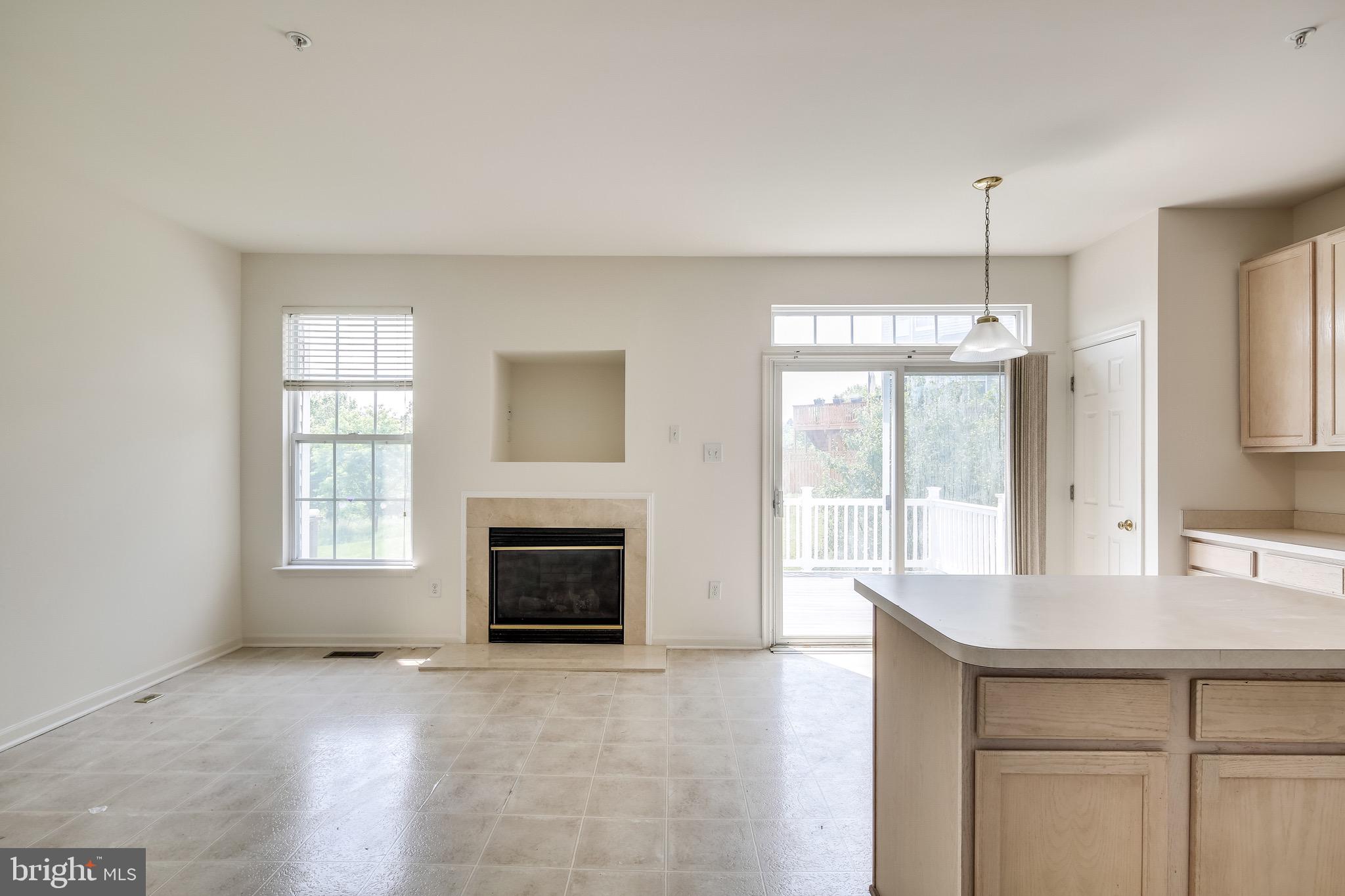 2702 Snowmill Court Ellicott City, MD 21043 - Photo 14 of 34 a view of an empty room with window and fire place