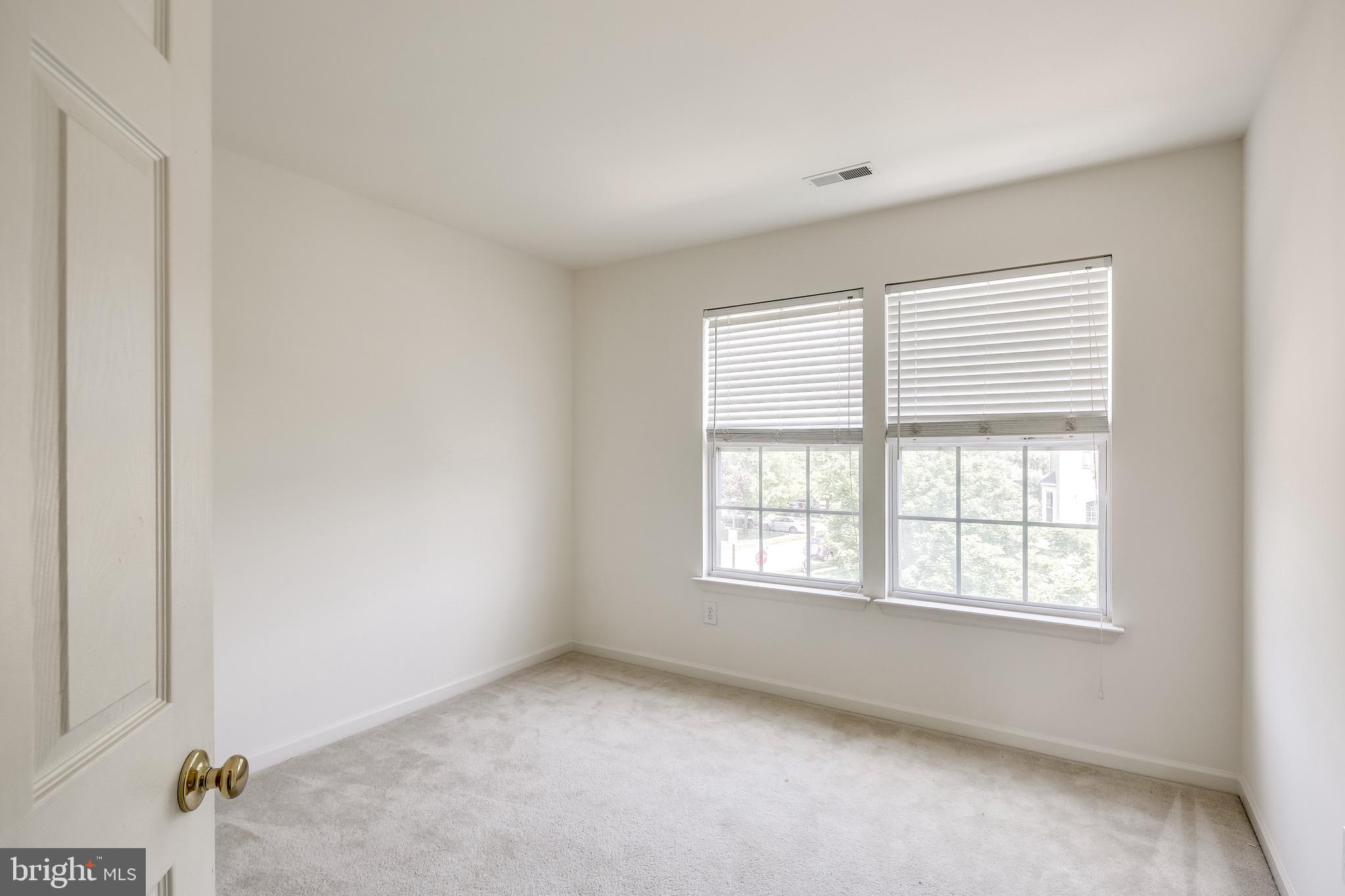 2702 Snowmill Court Ellicott City, MD 21043 - Photo 22 of 34 an empty room with a window