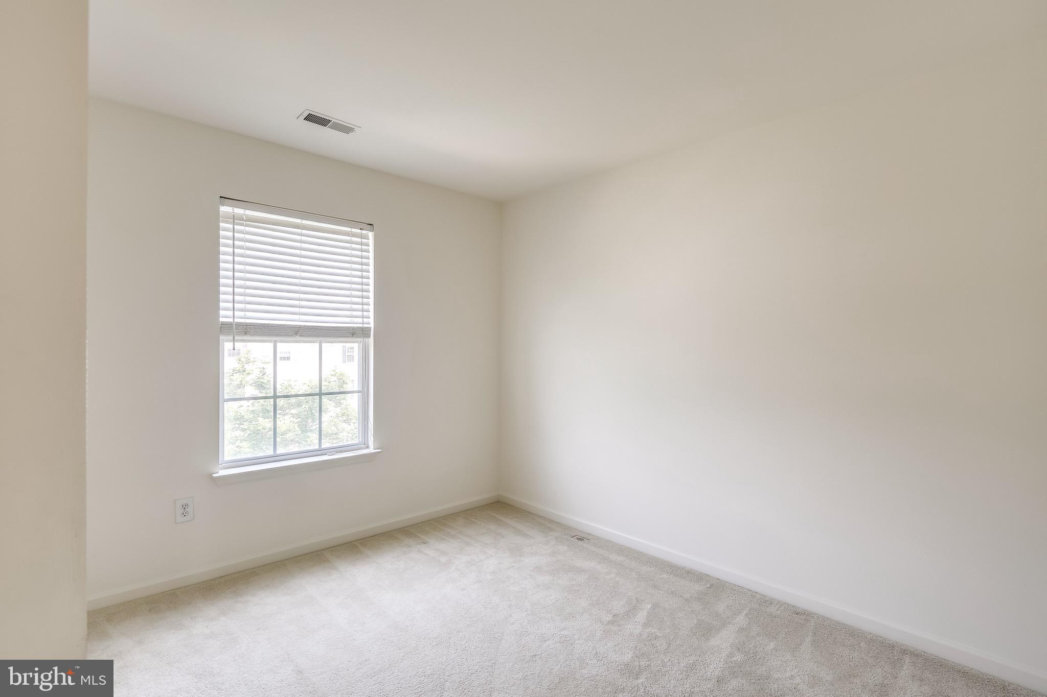 2702 Snowmill Court Ellicott City, MD 21043 - Photo 24 of 34 an empty room with windows
