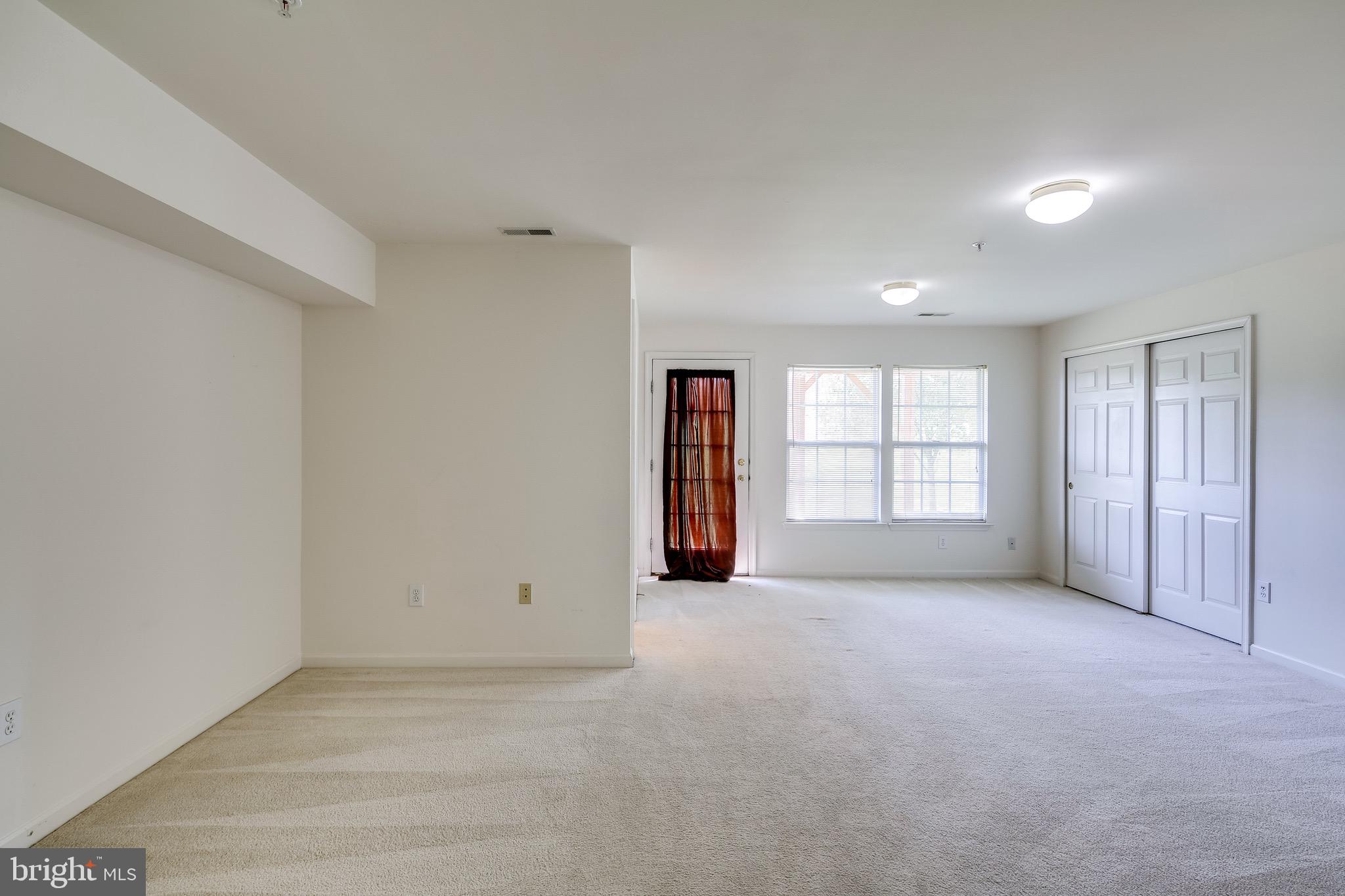 2702 Snowmill Court Ellicott City, MD 21043 - Photo 5 of 34 an empty room with windows