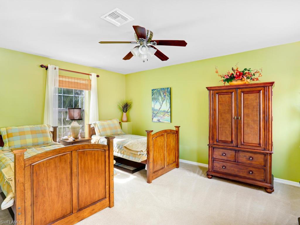 5786 Lago Villaggio Way Naples, FL 34104 - Photo 22 of 29 a living room with furniture and a window