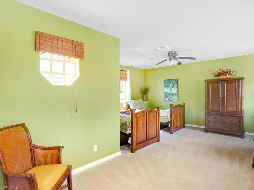 5786 Lago Villaggio Way Naples, FL 34104 - Photo 25 of 29 a view of a livingroom with furniture and windows