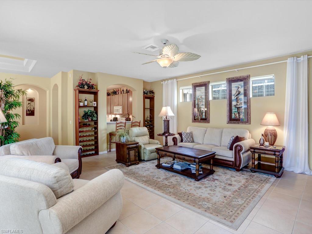 5786 Lago Villaggio Way Naples, FL 34104 - Photo 6 of 29 a living room with furniture