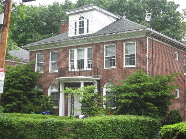 47 Algonquin Road Newton, MA 02467 - Photo 1 of 15 a front view of a house with a yard garage and outdoor seating