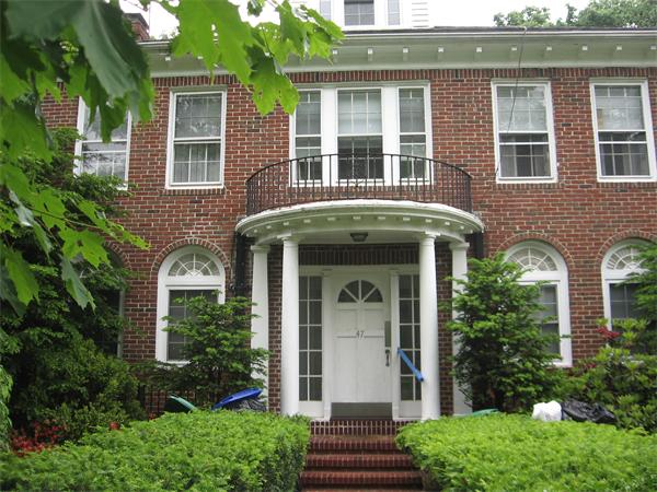 47 Algonquin Road Newton, MA 02467 - Photo 15 of 15 a front view of a house with garden