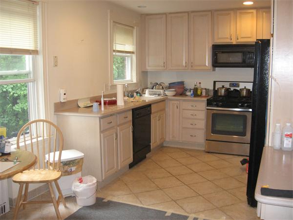 47 Algonquin Road Newton, MA 02467 - Photo 2 of 15 a kitchen with stainless steel appliances a stove a sink and a refrigerator