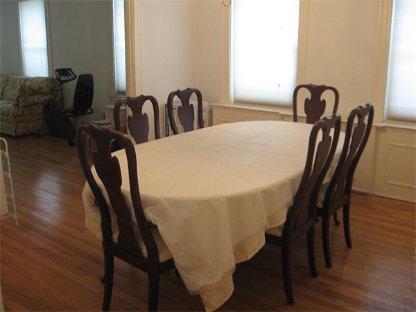 47 Algonquin Road Newton, MA 02467 - Photo 7 of 15 a view of a dining room with furniture and wooden floor