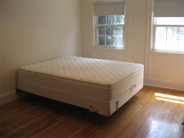47 Algonquin Road Newton, MA 02467 - Photo 8 of 15 a bed sitting in a bedroom next to a window