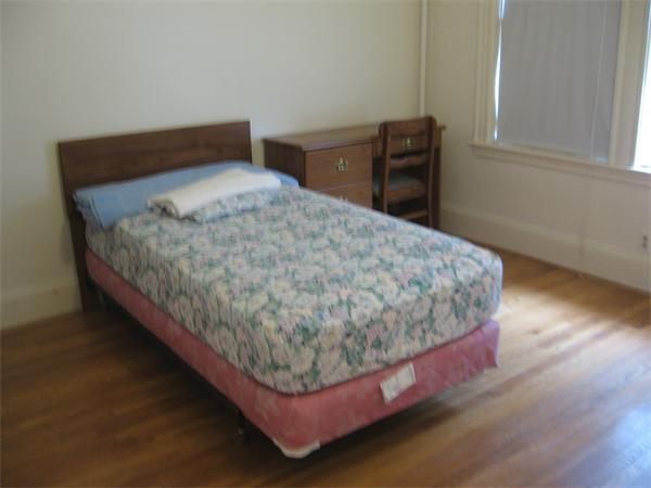 47 Algonquin Road Newton, MA 02467 - Photo 9 of 15 a bed sitting in a bedroom next to a window
