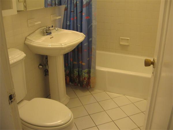 47 Algonquin Road Newton, MA 02467 - Photo 10 of 15 a bathroom with a sink a toilet and shower