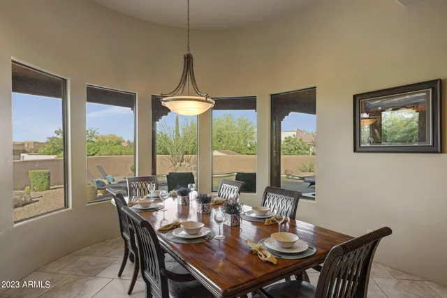 a view of a dining room with furniture window and outside view