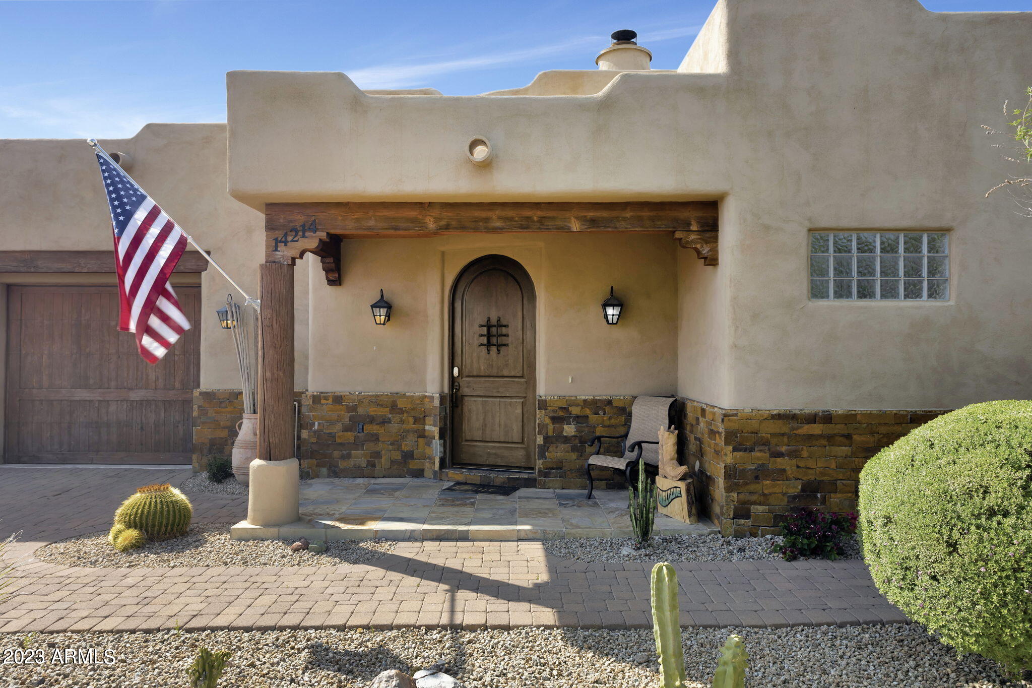 14214 East Gamble Lane Scottsdale, AZ 85262 - Photo 2 of 53 a front view of a house with garden