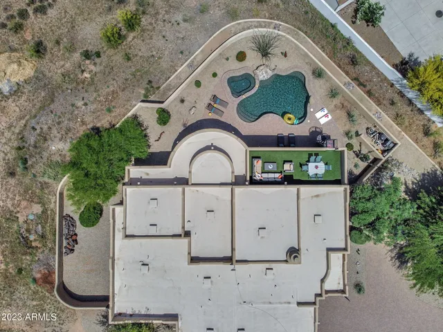 an aerial view of a house with swimming pool