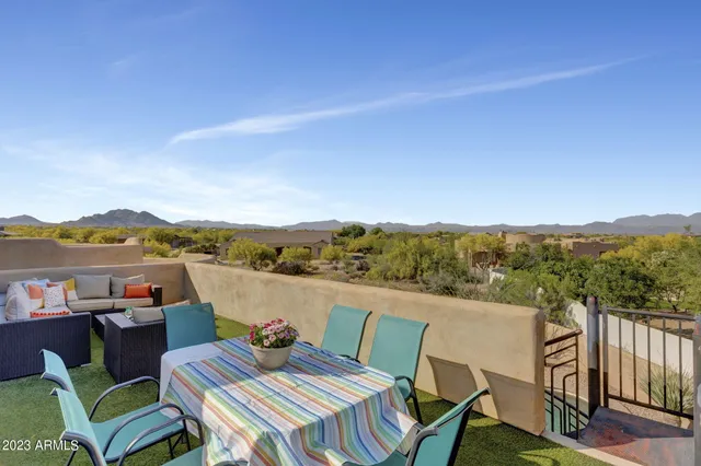 a outdoor living space with furniture and a potted plant