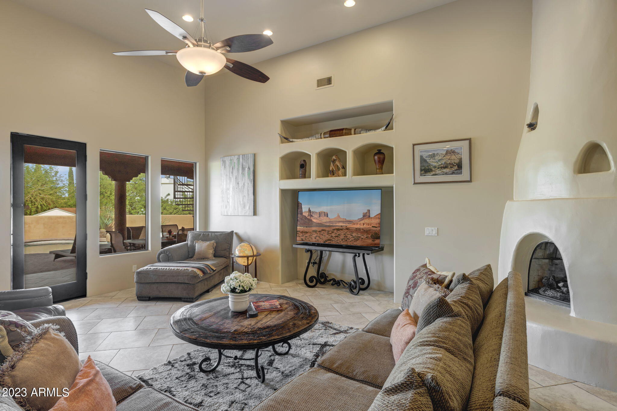 14214 East Gamble Lane Scottsdale, AZ 85262 - Photo 5 of 53 a living room with furniture and a fireplace