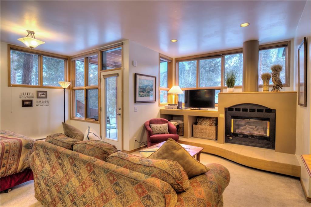2017 Soda Ridge Road, Unit 1943 Keystone, CO 80435 - Photo 3 of 21 a bedroom with a balcony a bed and a flat screen tv