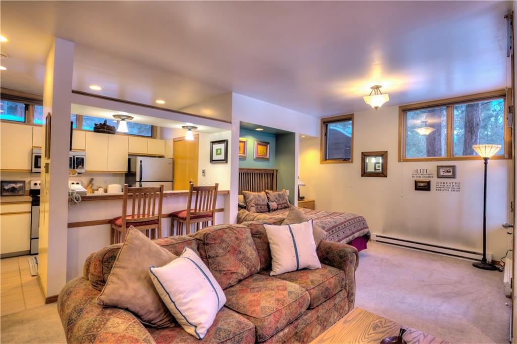 2017 Soda Ridge Road, Unit 1943 Keystone, CO 80435 - Photo 4 of 21 a living room with furniture and a table