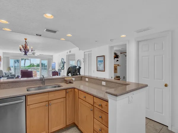 a kitchen with sink and cabinets