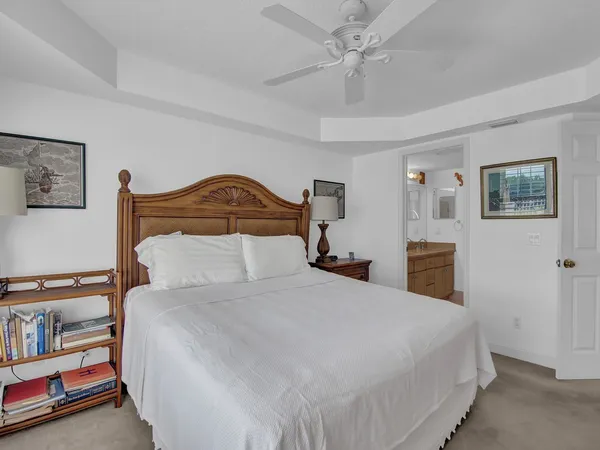 a bedroom with a bed and a book shelf