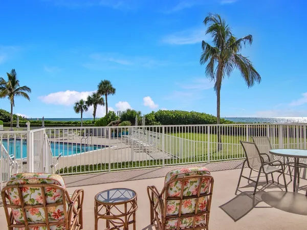 a view of a balcony with wooden floor and outdoor space