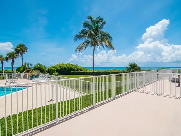 a view of a balcony and ocean view
