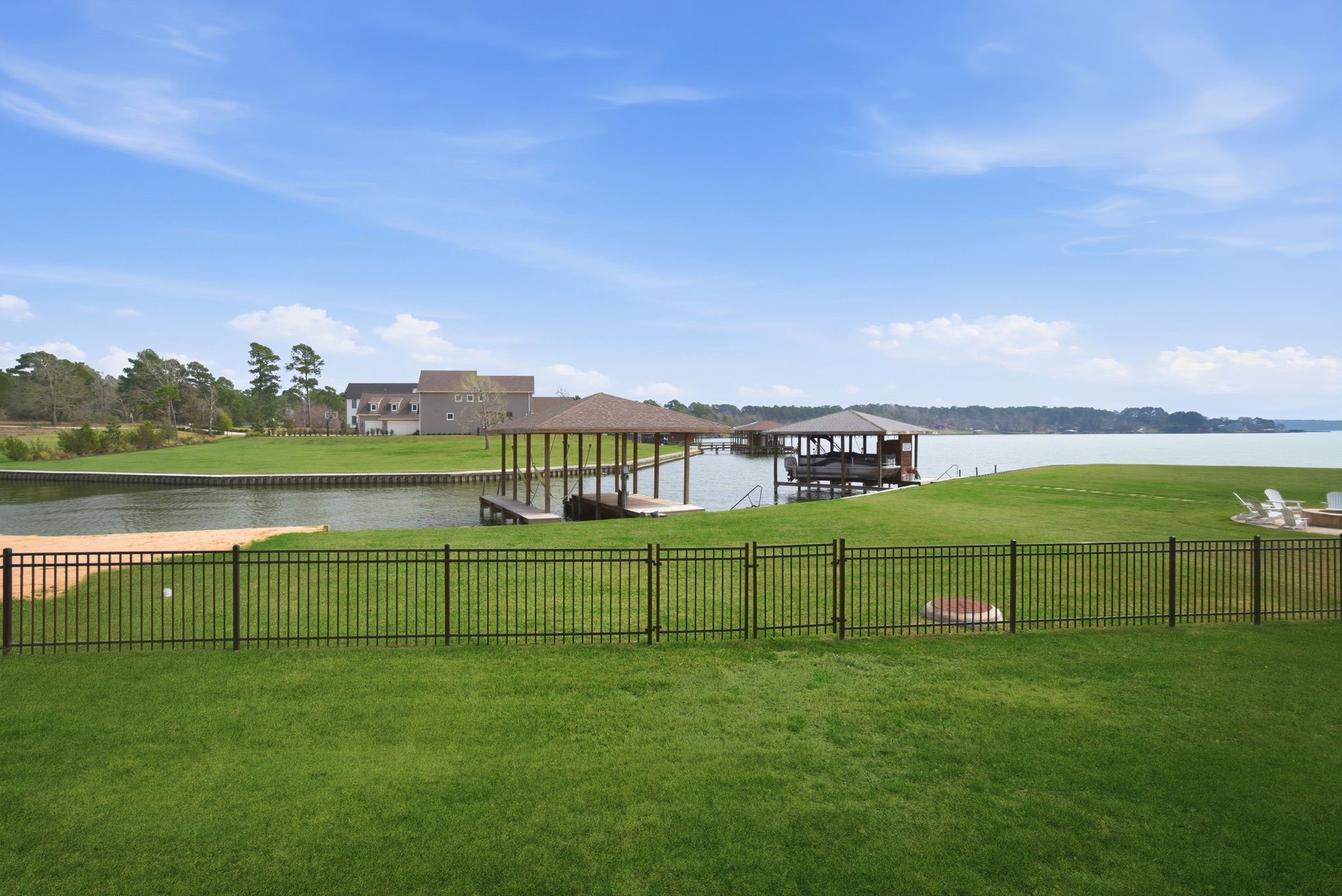 255 Peninsula Drive Livingston, TX 77351 - Photo 6 of 50 Fenced yard - gate is large enough that riding mower can get in.