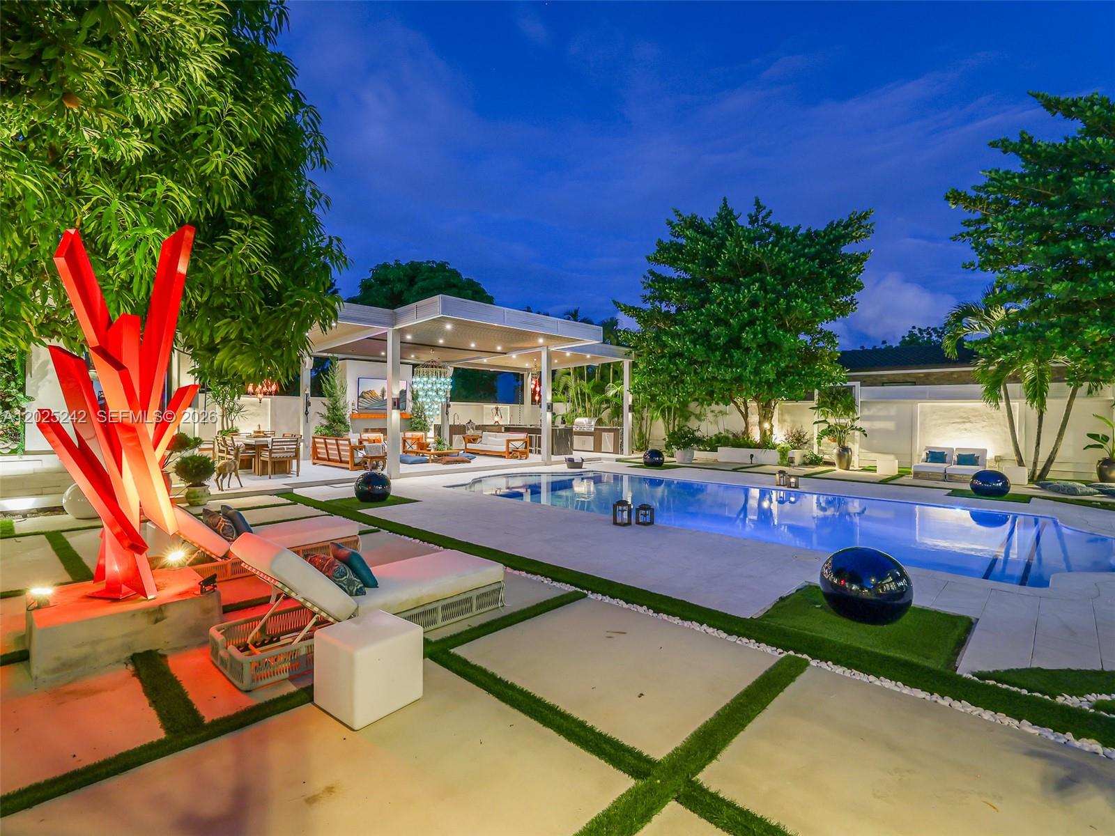 8761 Southwest 56th Street Miami, FL 33165 - Photo 76 of 90 a view of a backyard with swimming pool