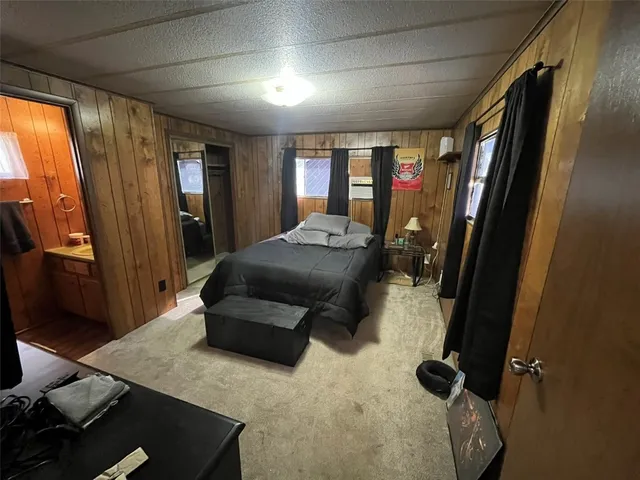 a room with a bed and a mirror