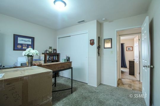 708 West Perdew Avenue Ridgecrest, CA 93555 - Photo 14 of 37 a room with furniture and a table