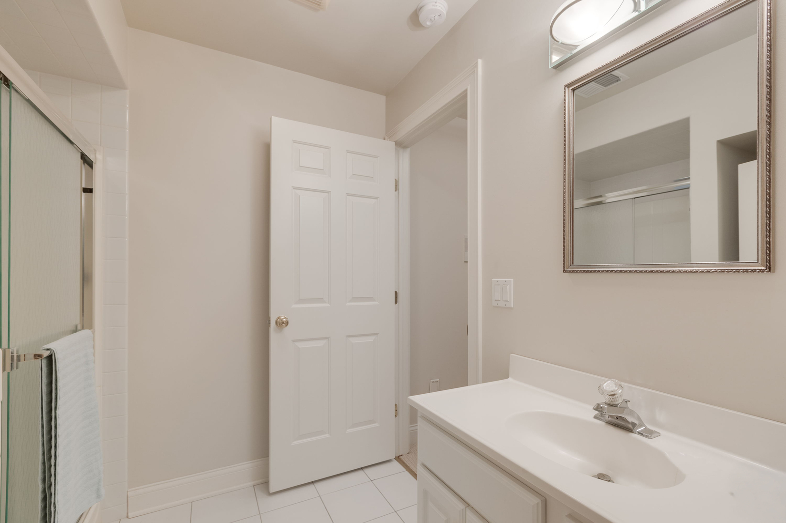 209 Carriage Trail Barrington, IL 60010 - Photo 29 of 42 a bathroom with a sink and a mirror