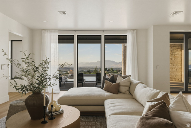 923 North Emery Lane Elk Ridge, UT 84651 - Photo 59 of 101 Open-concept living area with wood-finish flooring, recessed lighting, and large sliding glass doors